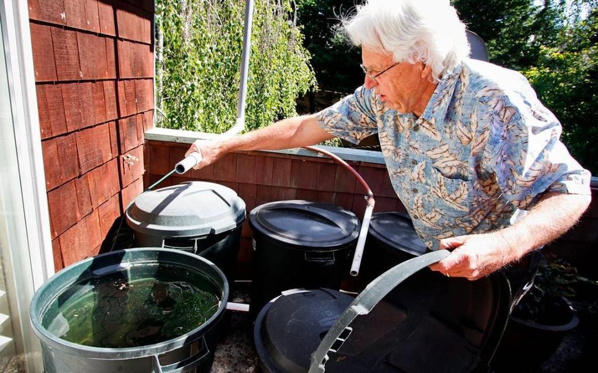 Bill Seavey of Cambria with one of his homemade rainwater catchment systems. Seavey was vacationing at Waikiki on Oahu when a false missile alert went out Saturday.