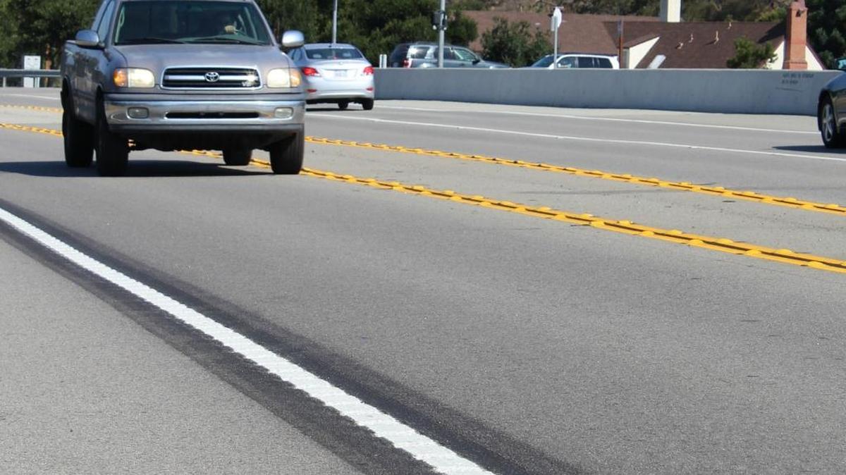 A southbound vehicle travels past rumble strips Tuesday morning on Highway 1 just south of Cambria Drive in Cambria.