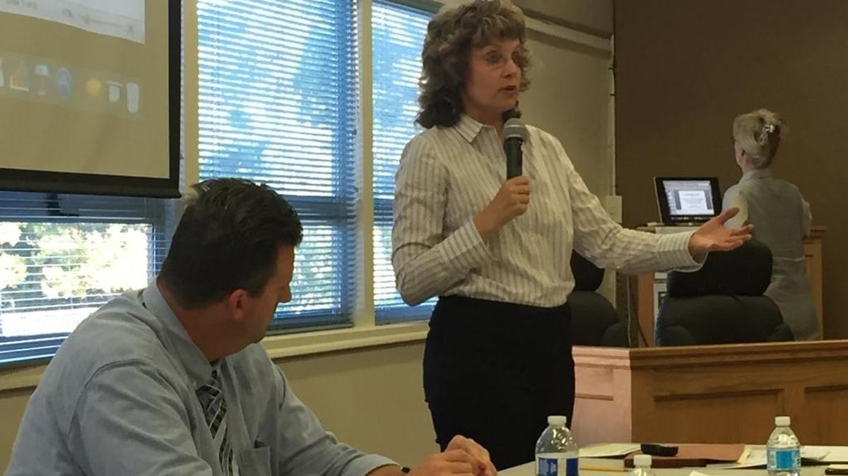 Coast Union Principal Scott Ferguson, left, watches as Coast Unified Superintendent Vicki Schumacher outlines the district’s goals under the Local Control Accountability Plan in a community engagement meeting Wednesday, Aug. 31, at the district board room.