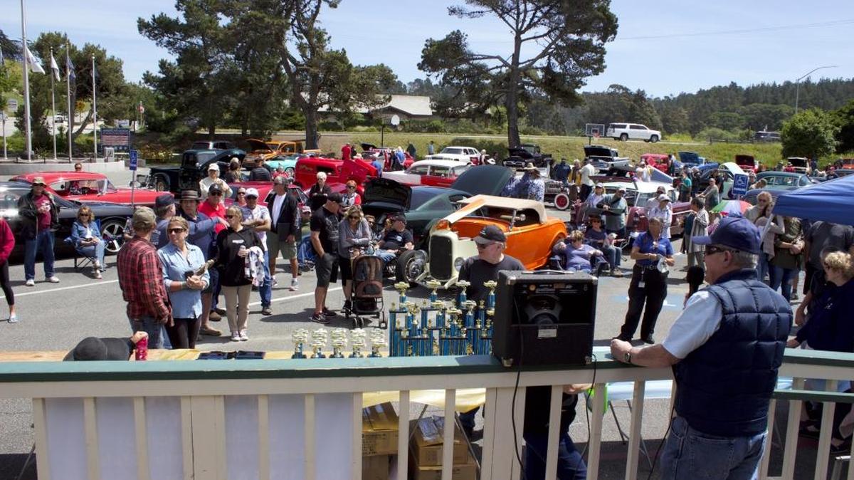 Mel McColloch announces trophy winners at the Cambria Car Show.
