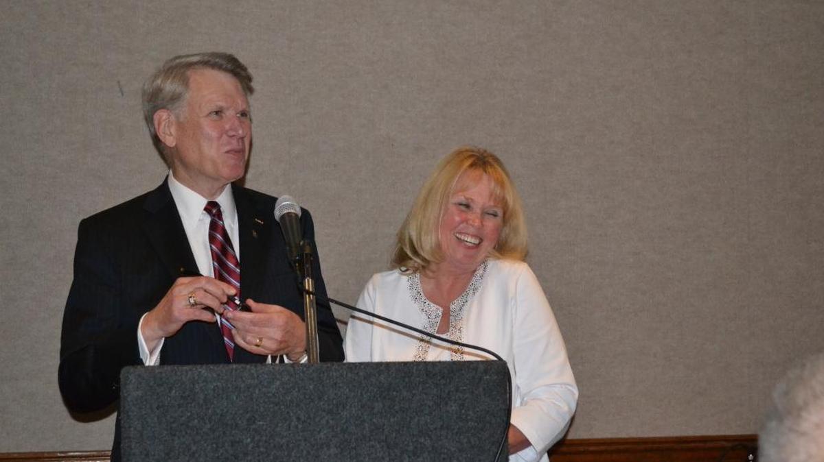 Greg and Teri Sanders share a laugh at the podium while being honored as Cambria’s Citizens of the Year on Tuesday night at the Cambria Pines Lodge.
