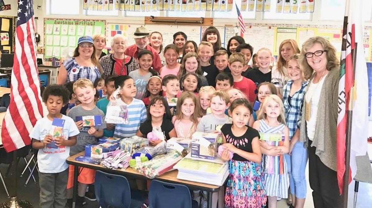 Arroyo Grande Valley Kiwanis President Jared Sharon, Past President Maureen Sharon, and board member Jolyne Alaniz joined Fairgrove Elementary School Principal Carol Littlefield, kindergarten teacher Sharon Wookey and students to celebrate the recent donation of two new flags made in memory of Chuck Knollenberg.