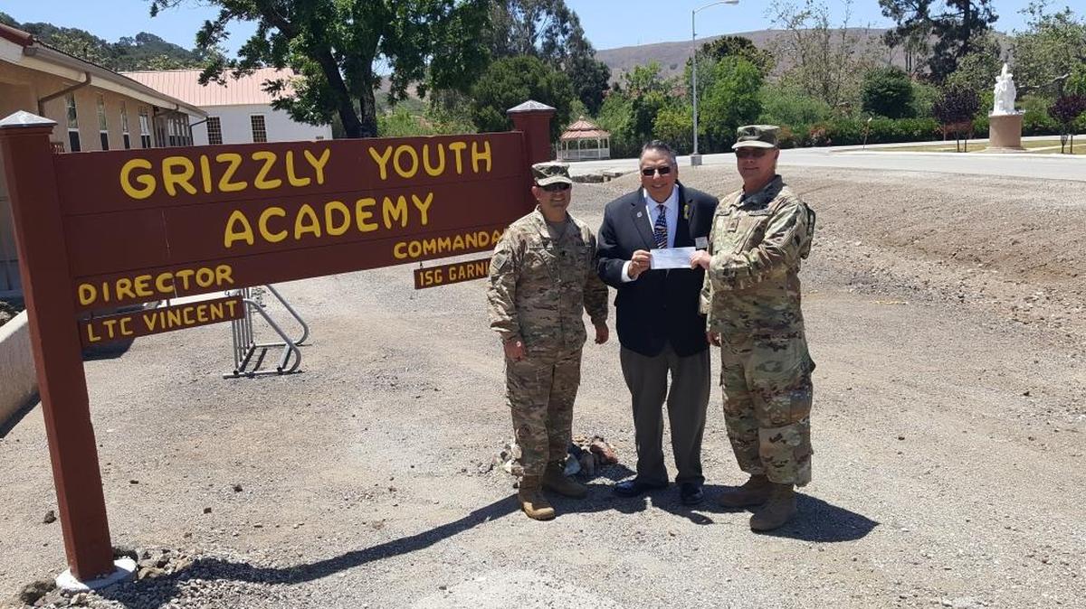 Larry Cook, center, from the Masons of King David’s Masonic Lodge, presents a check in the amount of $2,000 to Lt. Col. Tim Vincent, left, and Sergeant Robert Smith, right, for the Grizzly Youth Academy located at Camp San Luis Obispo.