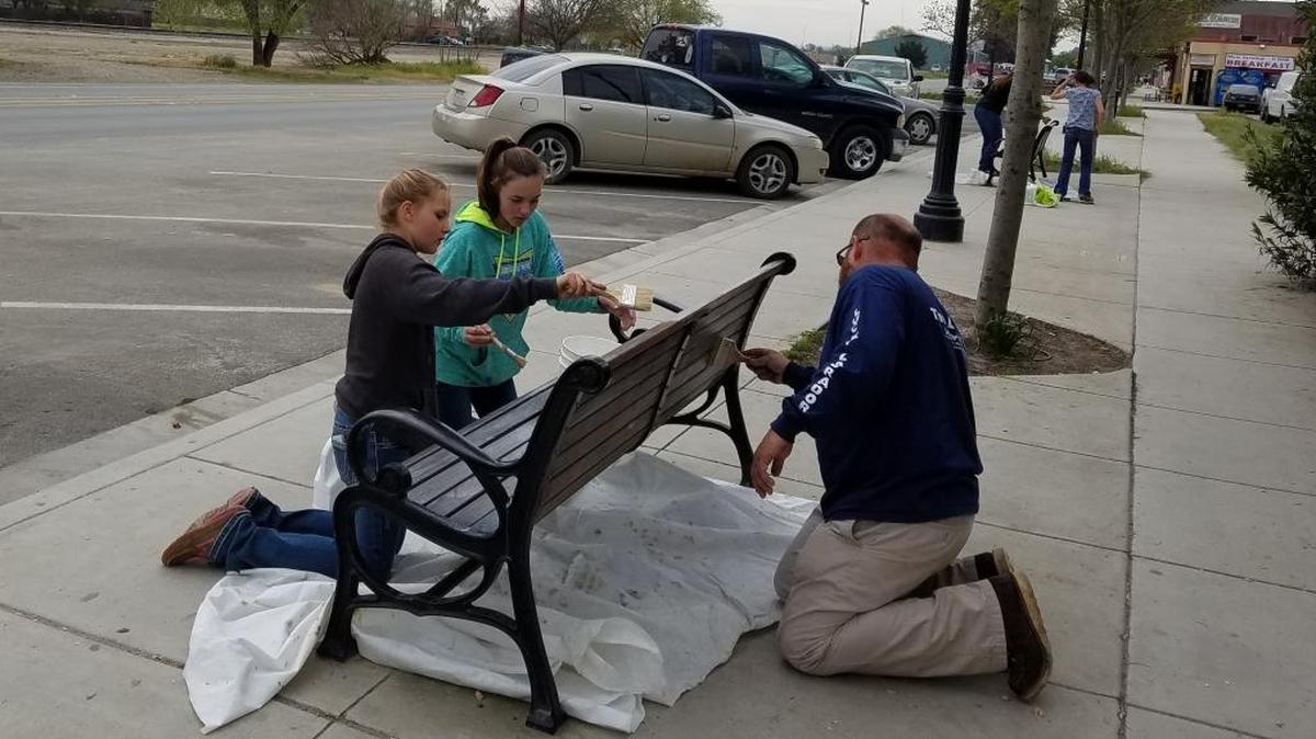 Members of Ranchita Canyon 4-H helped sand and oil the benches along Mission Street in San Miguel on March 19.