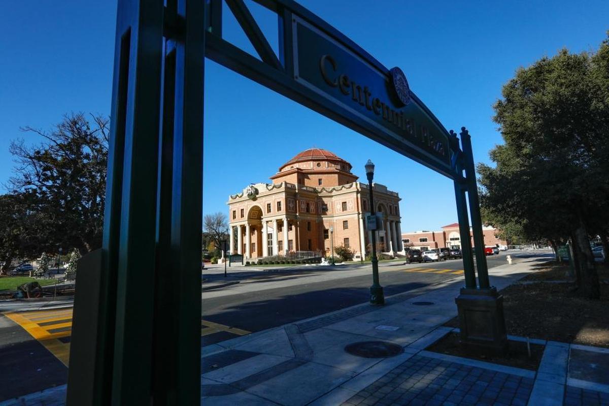 The Centennial Plaza gateway on East Mall frames Atascadero City Hall in background.