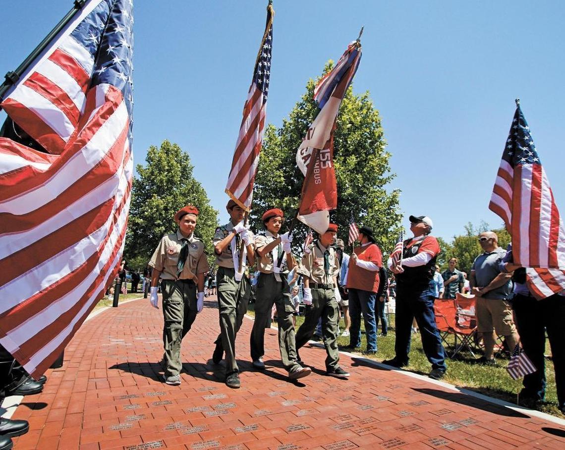 Members of Boy Scout Troop No. 155 present the colors during the 2015 Memorial Day ceremony at the Faces of Freedom Veterans Memorial in Atascadero. A Memorial Day ceremony will be held there on Monday, May 31, 2021.