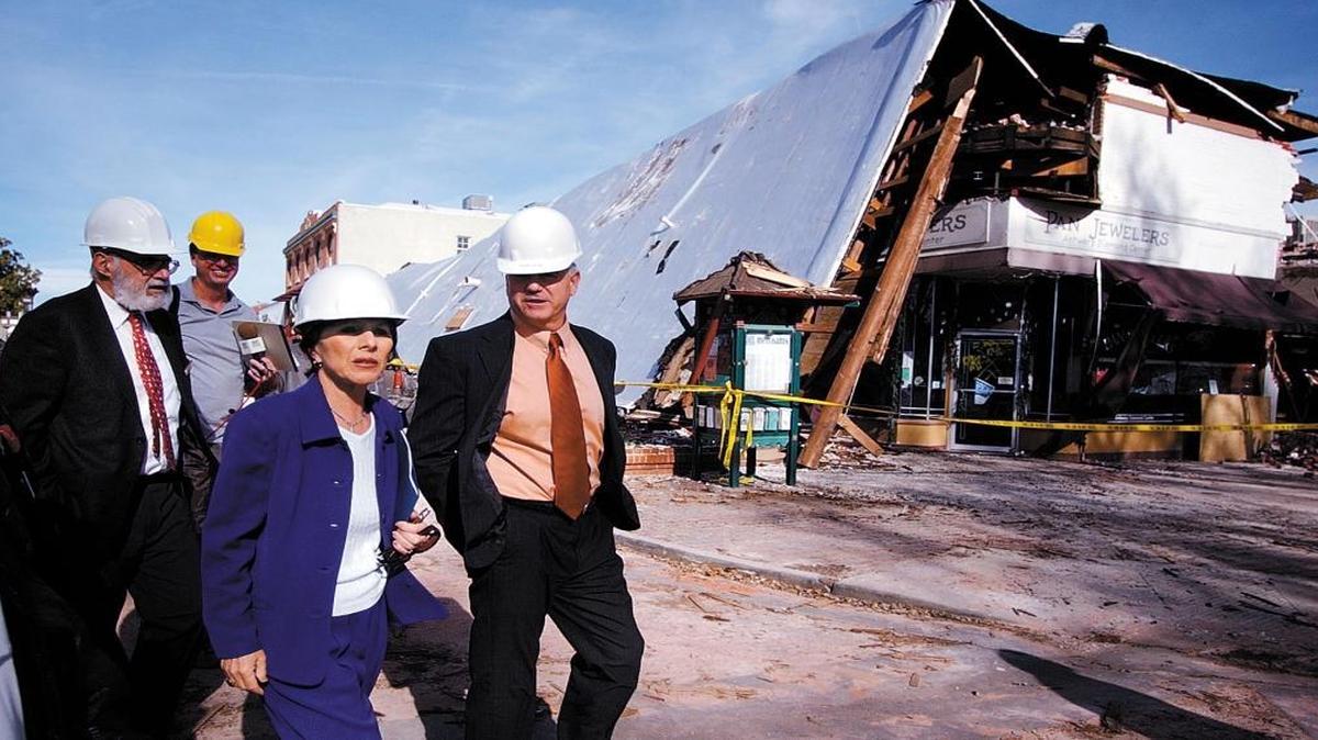 U.S. Sen. Barbara Boxer tours the San Simeon Earthquake damage in Paso Robles on Jan. 9, 2004. Walking past the Acorn building with Boxer are former Atascadero Mayor George Luna, left, and former Paso Robles Mayor Frank Mecham.