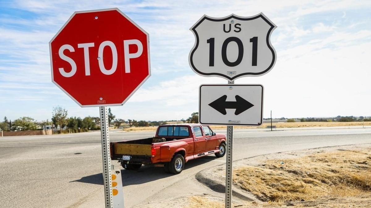 A pickup waits to enter Highway 101 at the intersection of Wellsona Road.