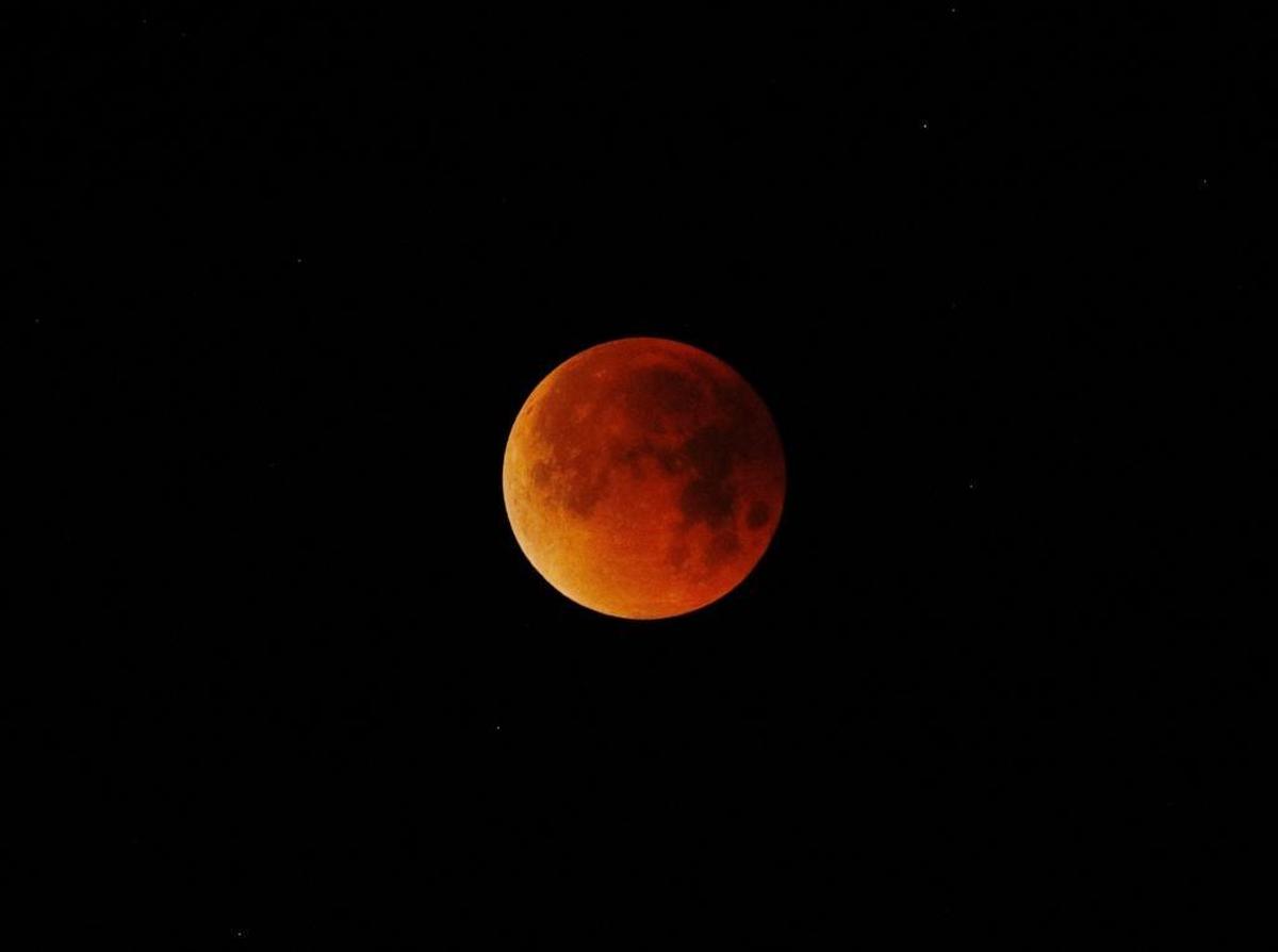 The super blue blood moon glows red in the sky over Pismo Beach on Jan. 31, 2018. July's blood moon will be the longest total lunar eclipse of the century.