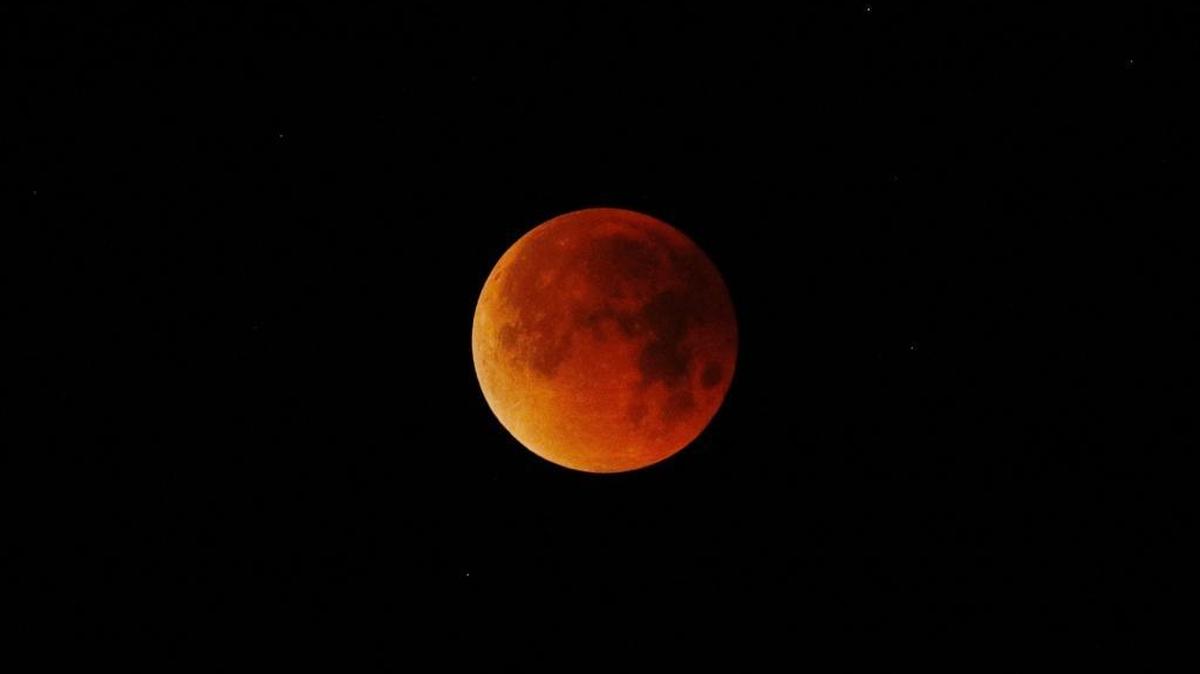 The super blue blood moon glows red in the sky over Pismo Beach on Jan. 31, 2018. July's blood moon will be the longest total lunar eclipse of the century.