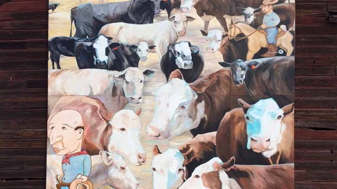 Son recreates father’s cow painting as a mural on side of old San Miguel mill