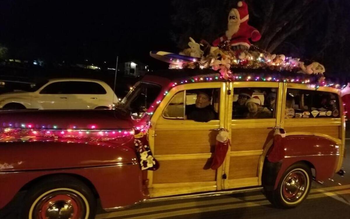 The McCain family decorated their 1947 Ford Woodie in a “Surfin’ Santa” theme and won the award for Best Individual Vehicle at the San Miguel Lights Parade on Saturday.