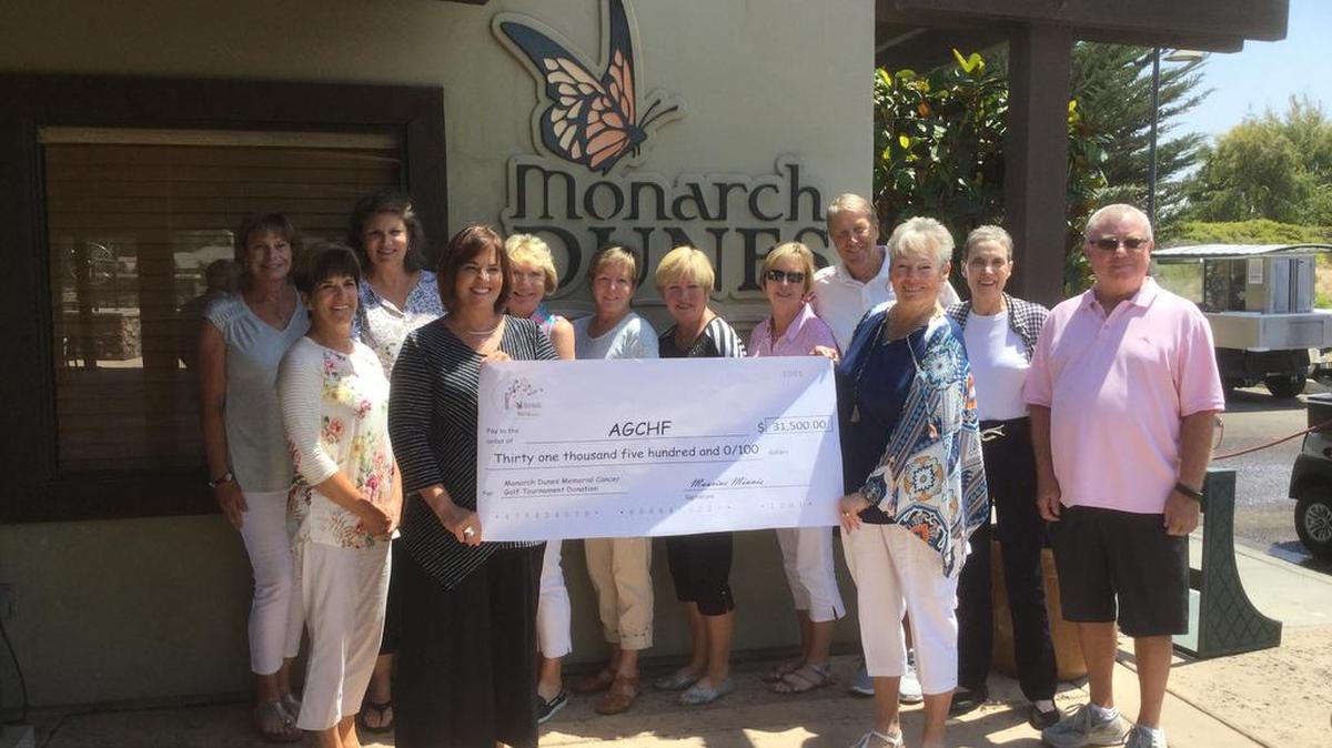 Maurine Minnis, chairman for the Monarch Dunes Memorial Cancer Golf Tournament, presents a check in the amount of $31,500 to Montisa Phelan Lopez, vice president of the Arroyo Grande Community Hospital Foundation.