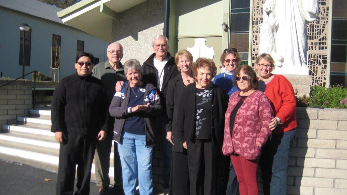 Parishioners and beneficiaries of a donation from St. William’s Catholic Church gathered for a group photo. From left, bottom row are The Rev. Edwin Limpiado, Susan Bumbaca, Carol Huffman of Loaves and Fishes, and Nancy Santos. Back row are Larry Stallings, ECHO vice president Till Moen, Susann Barber, Diane Olson and Micki Bagby.