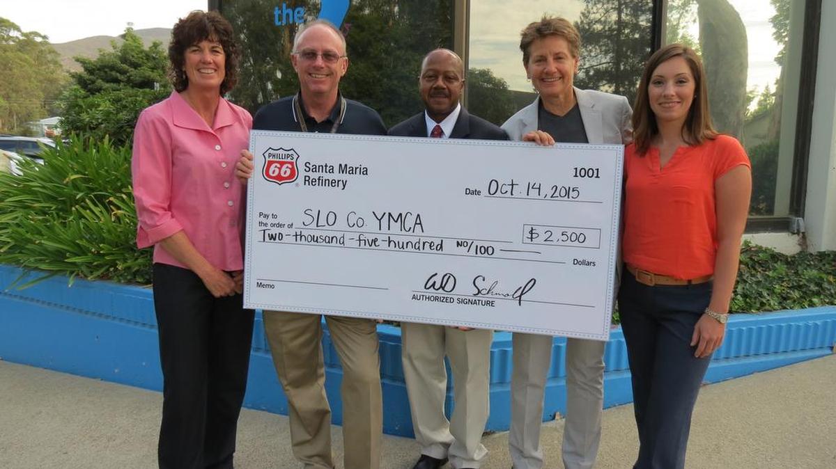 San Luis Obispo County YMCA is the recipient of a $2,500 donation from Phillips 66 Santa Maria Refinery. YMCA Chief Executive Officer Monica Grant, second from right, accepts the donation from Phillips 66 representatives, from left, Kristen Kopp, Bill Schroll, Marcus Beal and Rachel Penny. The funds will be used in South County for events, programs, after school care, camps and sports for children.
