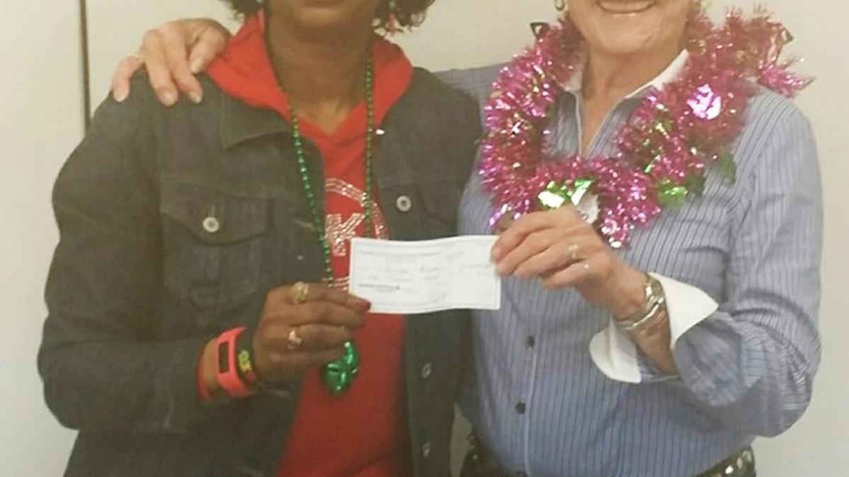 Kiwanis Club of Paso Robles President June Schneider, right, presents a donation for Lifestyles Recovery Center to Karolyn London, executive director of the center.