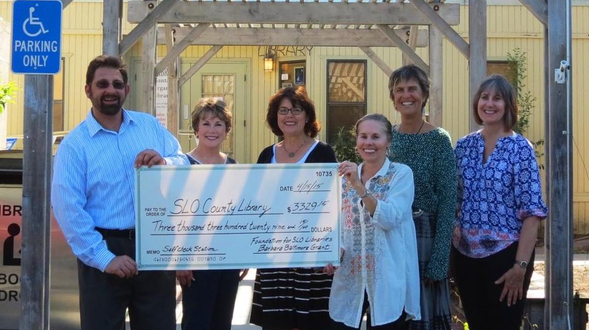 Members of the Foundation for San Luis Obispo County Public Libraries present a check to the Santa Margarita Library staff to pay for a new self-checkout station.