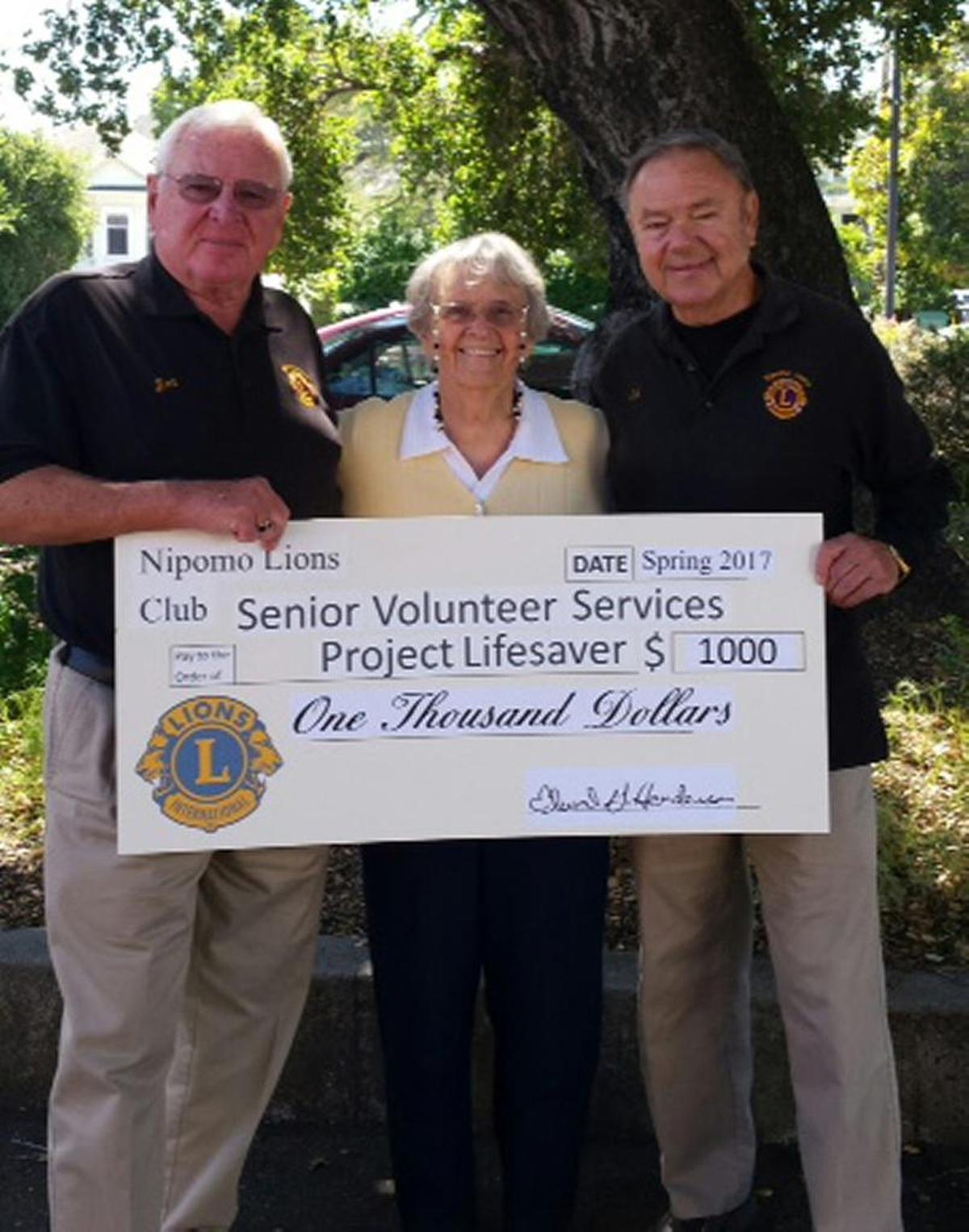 The Nipomo Lions recently donated $1,000 to Project Lifesaver. Jim Wiggins, donations chair, left, and Ed Henderson, Project Lifesaver coordinator, right, presented the donation to Marie Brinkmeyer, executive director of Senior Volunteer Services, administrator of the funds for Project Lifesaver.