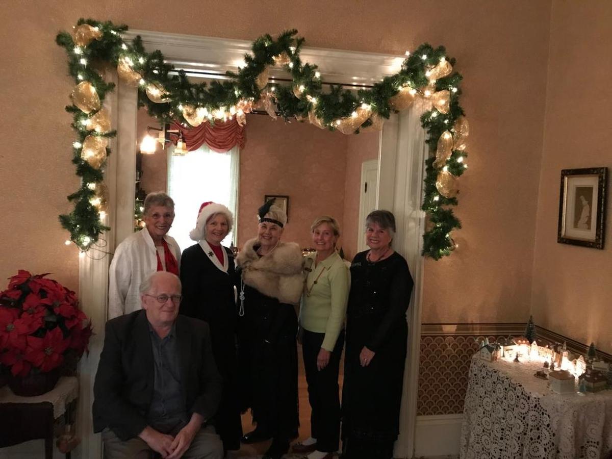 Docents of the historic Jack House wished everyone a happy holidays. The docents are pictured, from left: Donn Clarius, (sitting) Kathi Settle, Marilyn Darnell, Chris Oswald, Toni Kincaid and Maureen Titus.