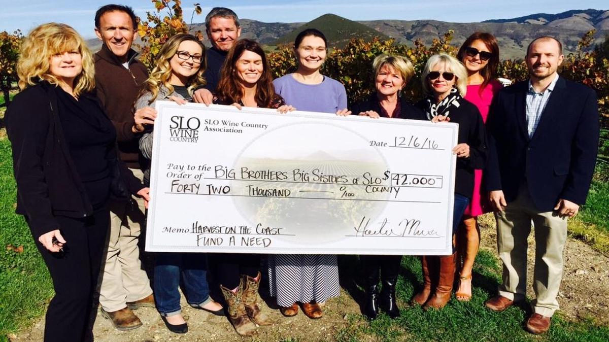 Big Brothers Big Sisters of SLO County is the recipient of a $21,000 donation from SLO Wine Country and a matching $21,000 gift from Big Brothers Big Sisters board of directors. Representatives from both organizations gathered for a check presentation of the donations raised at SLO Wine Country’s Harvest of the Coast event.