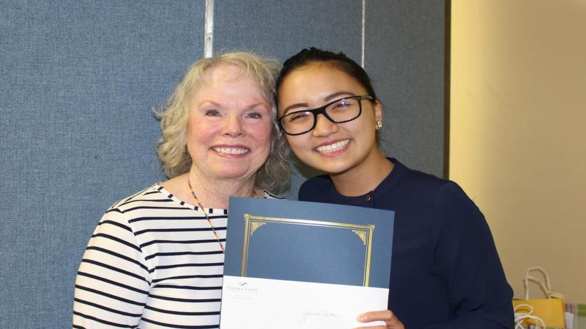 The Sierra Vista Regional Medical Center Volunteer Auxiliary awarded a $1,000 college scholarship to emergency room volunteer Jennifer Tran, right. Cheri Nicklaus, ER volunteer coordinator presented the scholarship award.