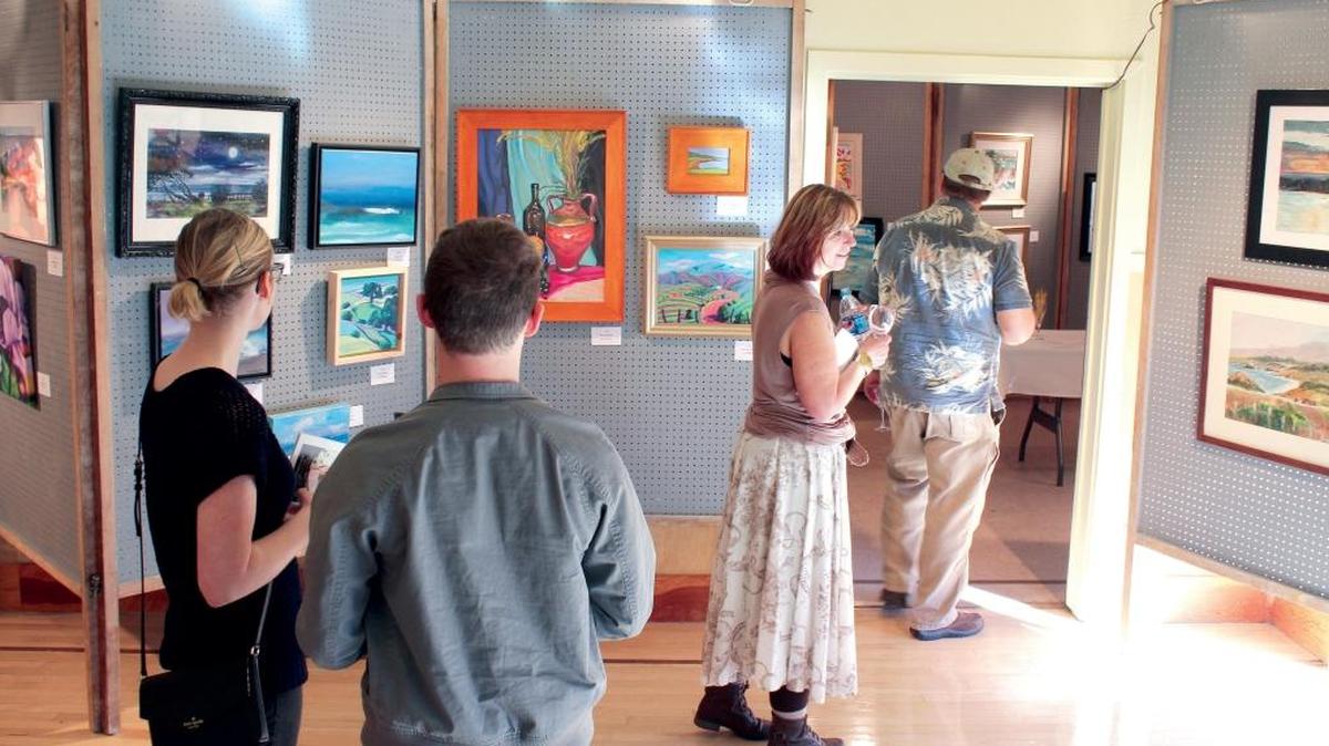 Visitors peruse artwork at the 2016 Cambria Art & Wine Festival.