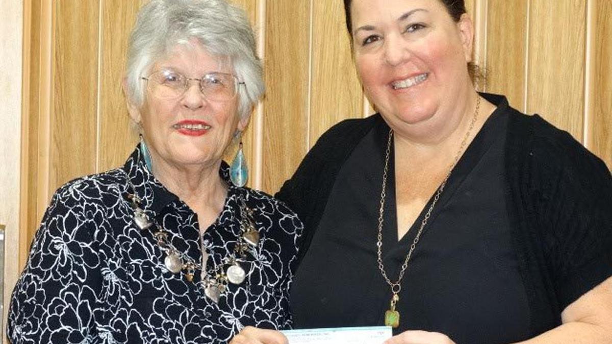 Lynne Schmitz, left, presents a donation of $1,000 from the SLO County Farm Bureau Women to Karen Borges of Jack’s Helping Hand. Farm Bureau Women raise funds at the bi-annual Three Speckled Hens Antique Show in Paso Robles, which helps support the charity.