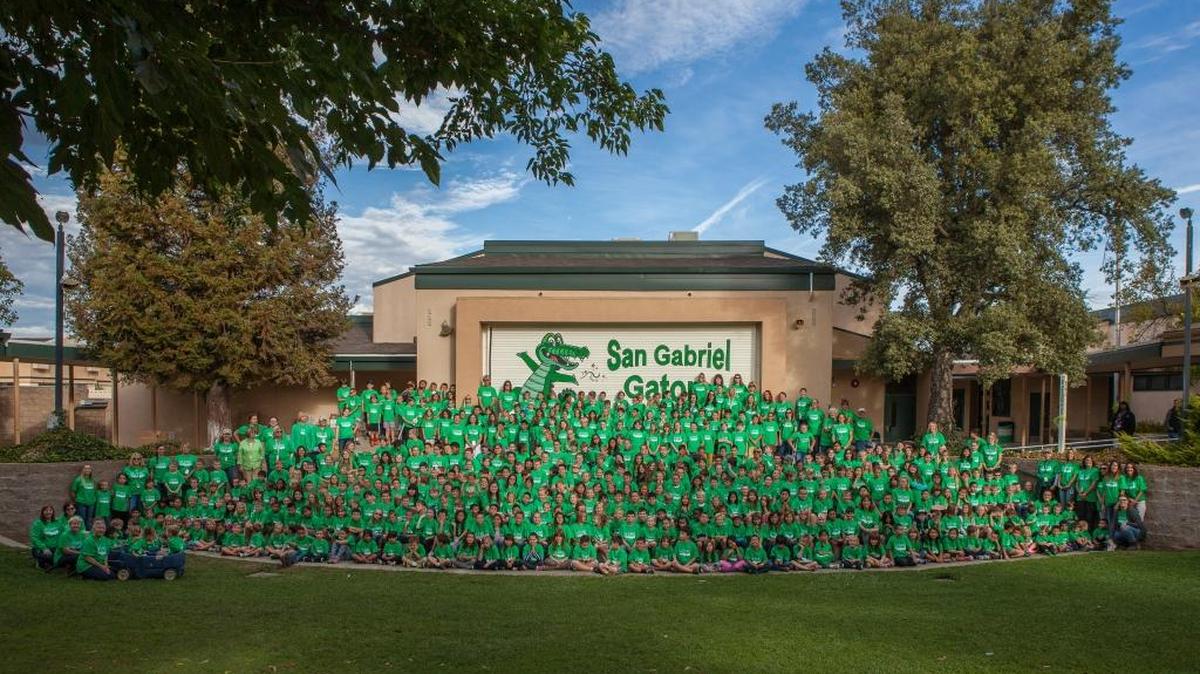 Thanks to generous donations from local businesses, every student at San Gabriel Elementary School in Atascadero received a green T-shirt depicting the schools Gator mascot. The whole school gathered for a photo in their new shirts.