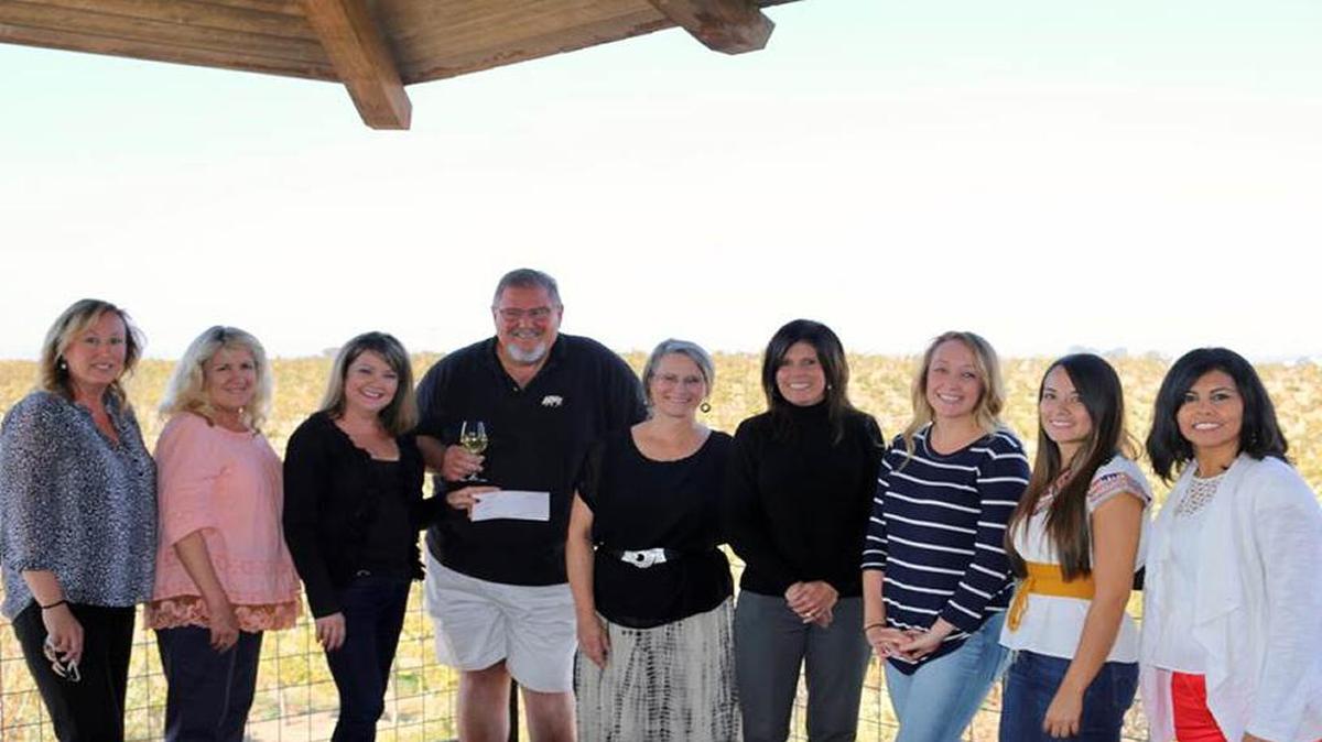 As a result of its Haunted Caves event, Eberle Winery raised a $2,353.18 donation for the SLO Kinship Center. At the check presentation, from left, are Melinda Staley and Jeanne Hunt, Kinship Center leadership board members; Marcy and Gary Eberle, donors; Marta Nielsen, Tina Lehman, Lizzy Dembosz, Isabel Ramirez, Kinship Center staff; and Oralia Guzman, Eberle Winery events coordinator.