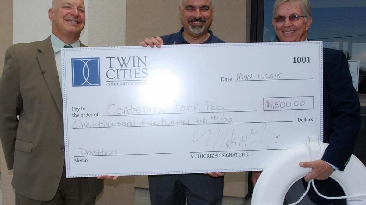 Twin Cities Community Hospital donated $1,500 toward the reopening of Centennial Park Pool in Paso Robles. Paso Robles City Councilman Steve Gregory, right, accepted the donation from Mark Lisa, Twin Cities CEO, center, and Ron Yukelson, Twin Cities chief business development officer.