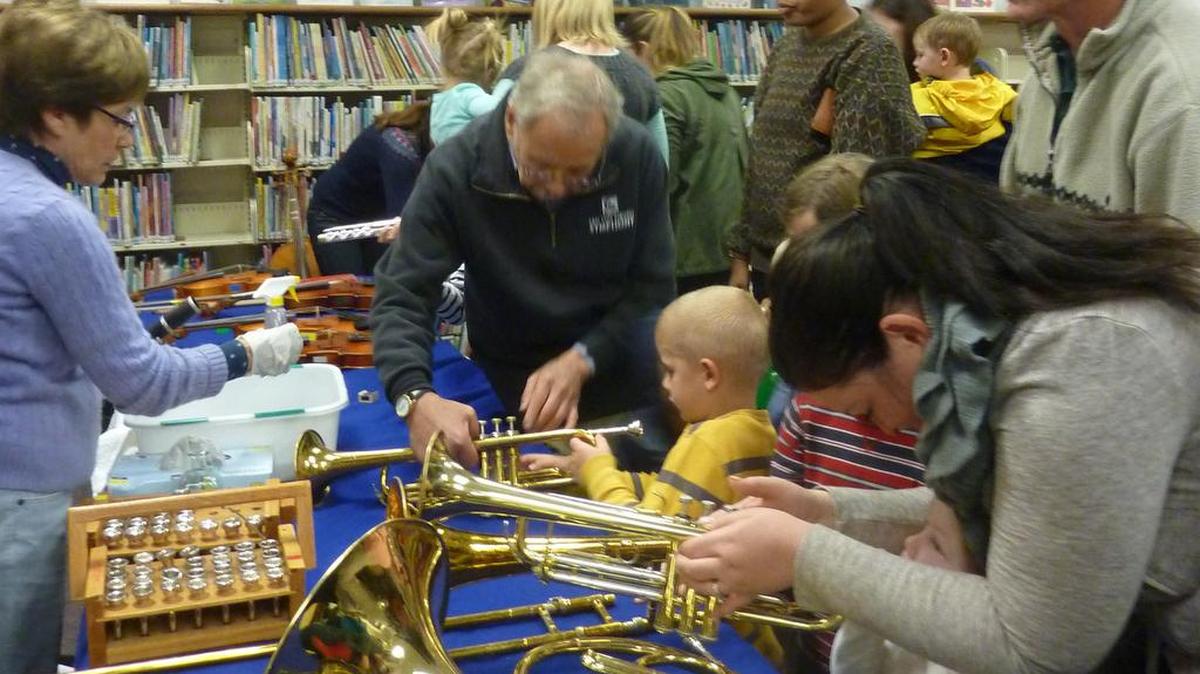 One of the past Harold J. Miossi Trust-funded library programs was this hands-on musical instrument learning experience.
