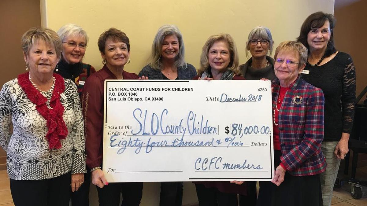 Cheryl Fernandez, Linda Rundstrom, Joanne Rogoff, Debbie Craven, Susan Murray, Muriel Harkins, Patti Hempenius and Paula Tolbert from Central Coast Funds for Children present a check in the amount of $84,000 to 34 different local organizations in support of local children.