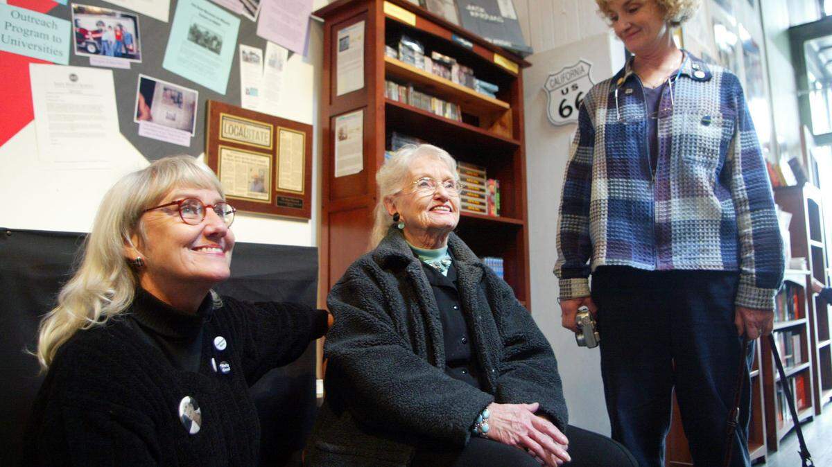 This 2006 file photo shows late Beat writer Neal Cassady’s  daughter, Jami Cassady, left, his late wife, Carolyn Cassady, center, and daughter, Cathy Cassady, smiling while visiting “The Beat Museum,” in the North Beach district of San Francisco.