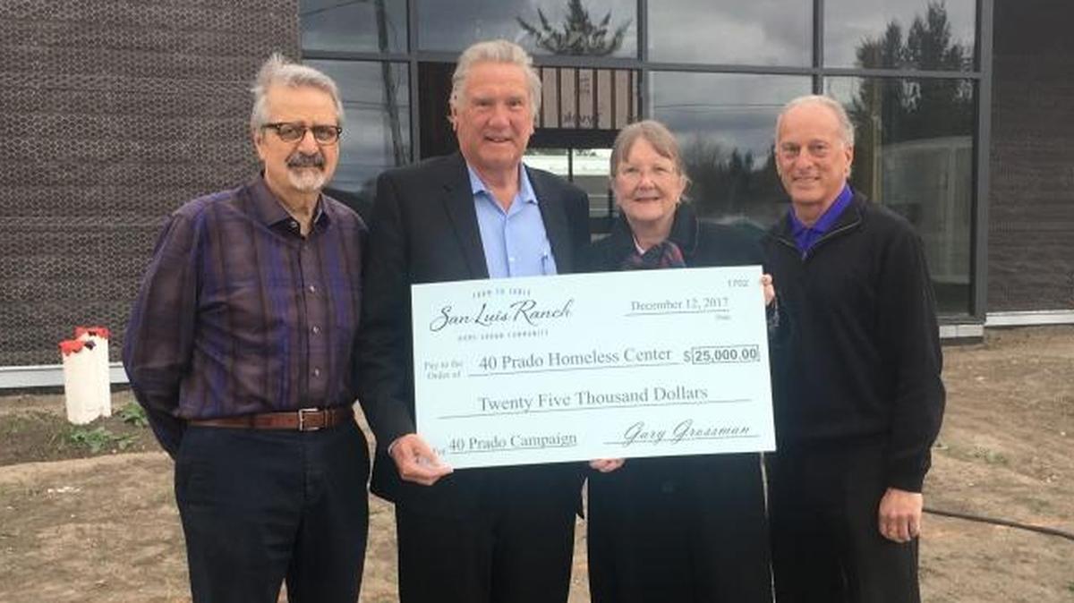 John Spatafore, co-chairman of Friends of 40 Prado, from left; Marshall Ochylski, project manager for San Luis Ranch; Biz Steinberg, CEO; and Jim Famalette, COO for Community Action Partnership of San Luis Obispo County with Gary Grossman’s recent $25,000 donation to 40 Prado Homeless Services Center.