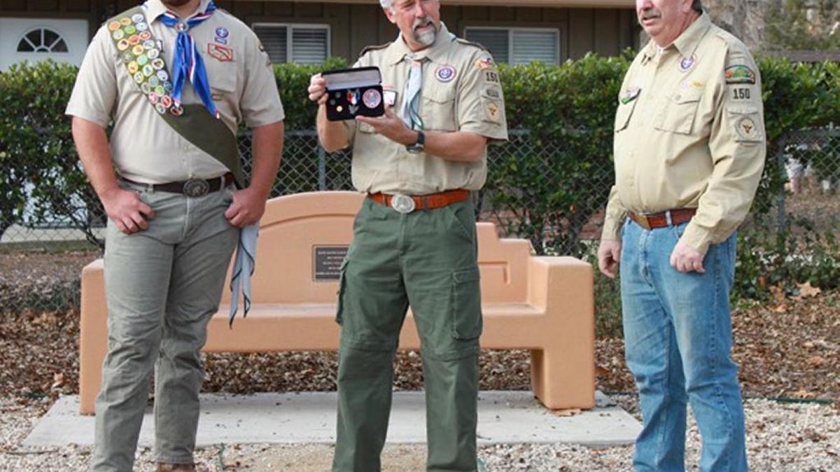 From left, Zack Adams of Atascadero Boy Scout Troop 150 recently received a Eagle Scout Award from from his Scout Master Stan Wilt and assistant Scoutmaster Jim Bond. They are pictured in front of his Eagle project at Atascadero Lake Park, where he landscaped and built a pad for a new bench with the help of James Pech of Aqua Doc and Richard and Ricky Pech.