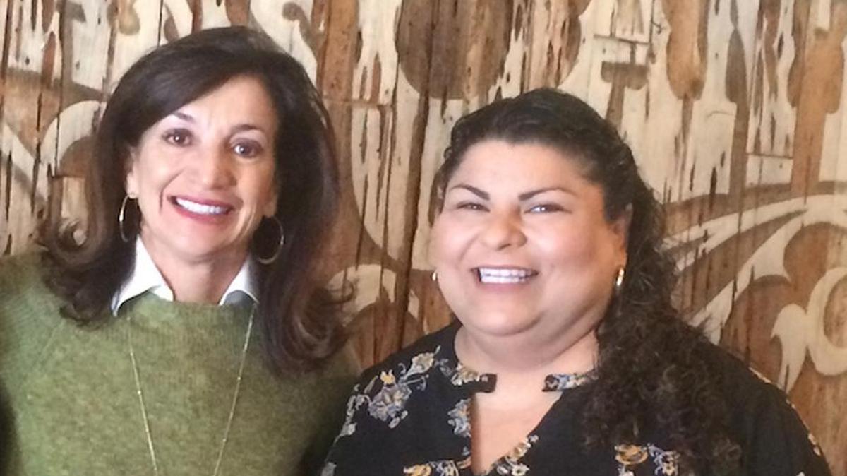 Jack’s Helping Hand co-founder Bridget Ready, left, receives a $5,000 donation from Old Juan’s Cantina owner Eva Verdin.