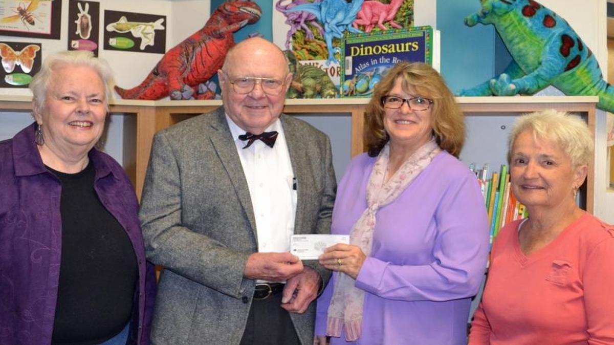 The SLO Noontime Kiwanis Club donated $650 to the SLO Friends of the Library/American Association of University Women’s In-School Reading Program. At the presentation are, from left, Linda Thompson, program coordinator; Richard Riggins, Kiwanis member and reading volunteer; DD Patrick, president of AAUW; and Maureen Dresp, reading volunteer.