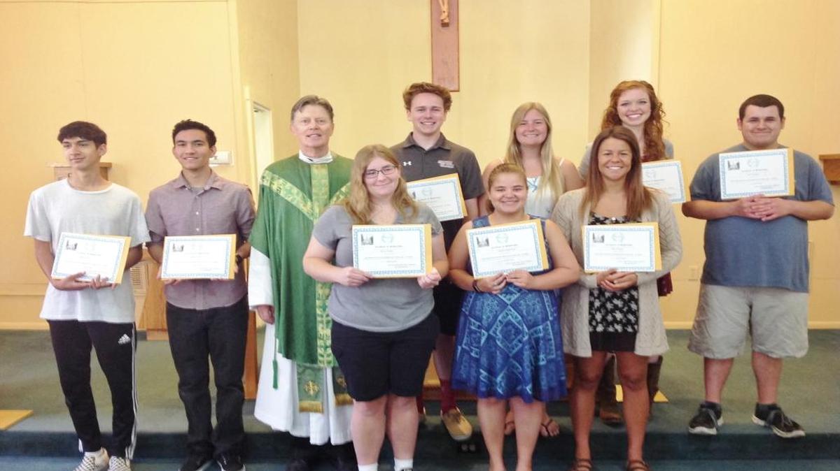 Santa Margarita de Cortona Catholic Church recently awarded $1,250 scholarships to 10 parish students. Some of the recipients are shown here with Father Robert Travis.