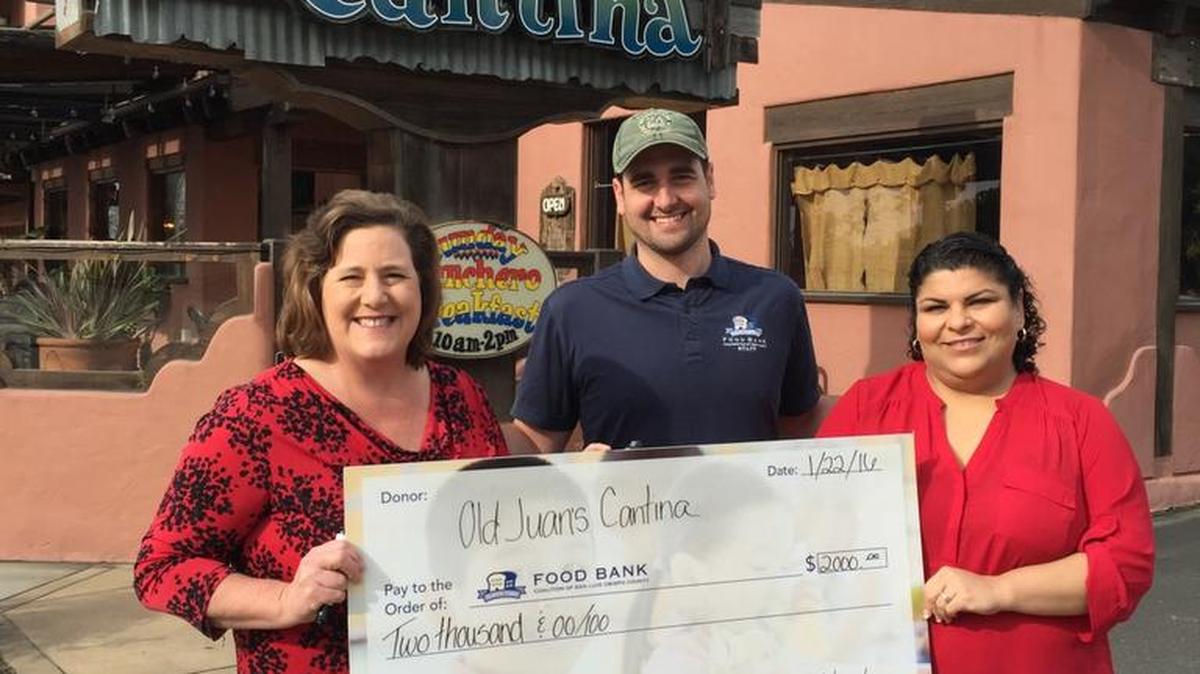 Local Mexican restaurant Old Juan’s Cantina in Oceano organized a fundraising effort that brought in $2,000 for the Food Bank Coalition of San Luis Obispo County. From left, Wendy Lewis and Tim Parker of the Food Bank with restaurant owner Eva Verdin.