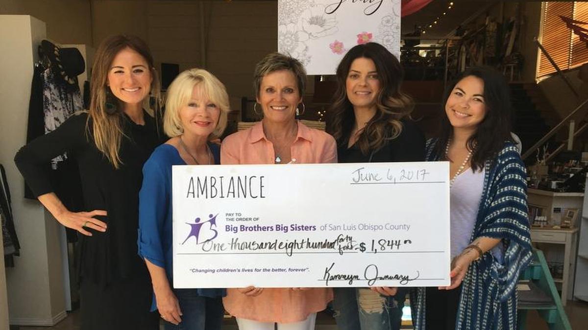 From left, Big Brothers Big Sisters President Christie Clemons, Past President Karen Colombo and Development Director Patty Carpenter accept a check from Ambiance owner Kannyn January and Manager Jacui Clark-Charlesworth.
