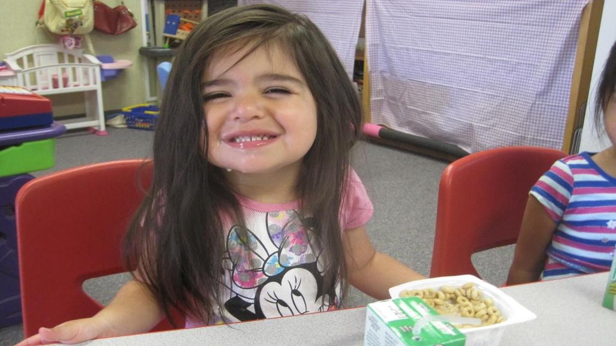 A summer school student enjoys her breakfast, thanks to the Food Bank Coalition of San Luis Obispo County’s Summer Breakfast Bag program.
