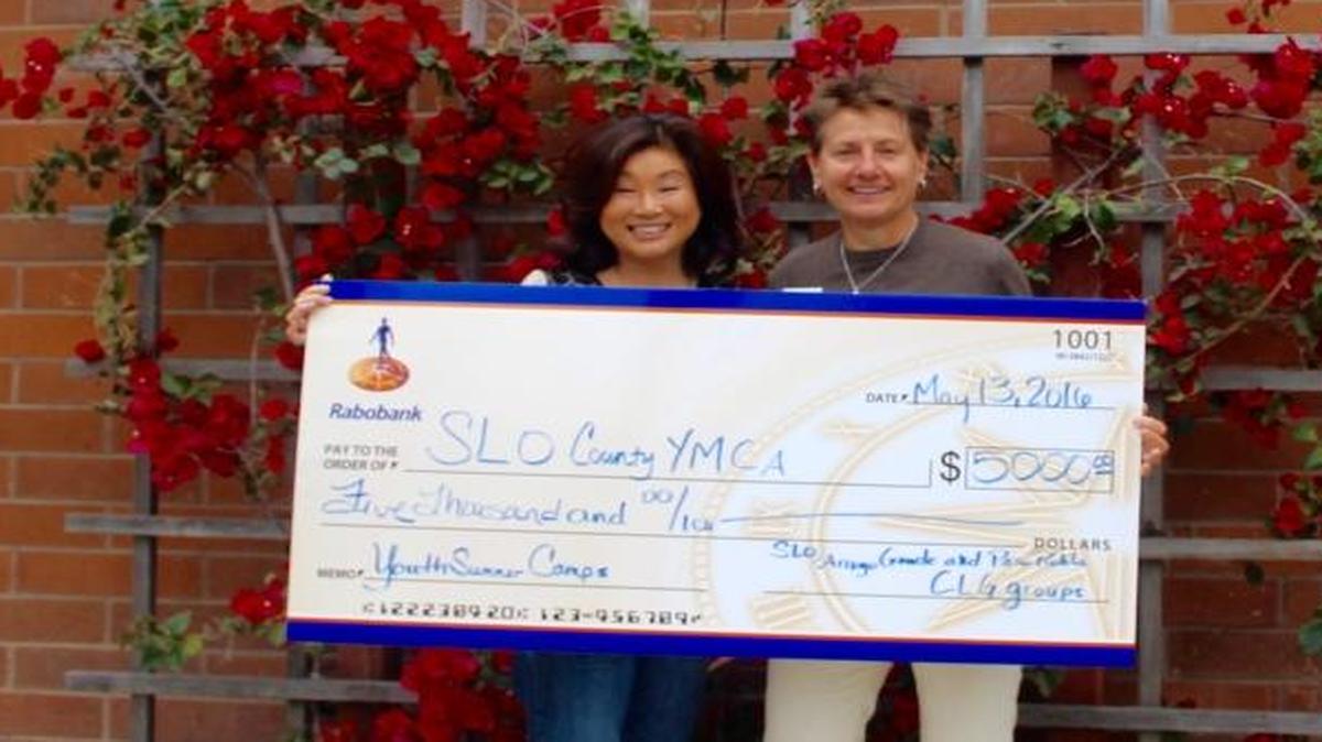 Lisa Adams, left, vice president/branch manager at Rabobank San Luis Obispo and Monica Grant, San Luis Obispo County YMCA CEO, hold a celebratory check of $5,000 that Rabobank donated to the YMCA.
