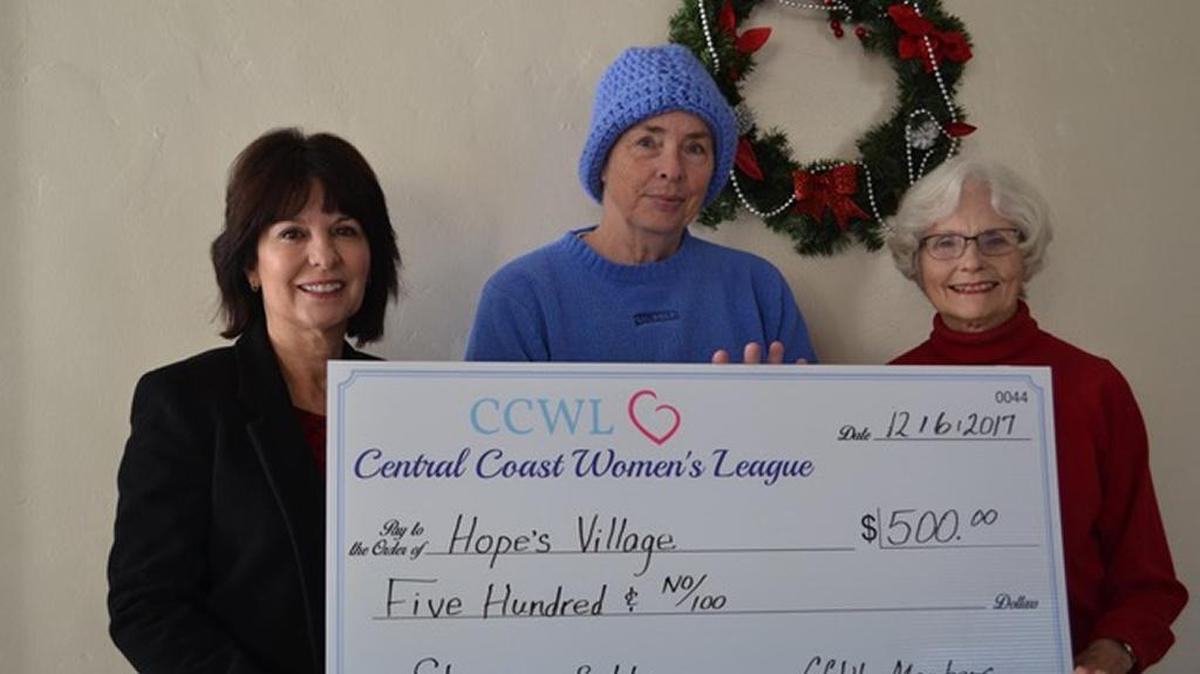 Presenting the $500 check to Becky Jorgeson, director of Hope’s Village, center, are Denise Topham, president of Central Coast Women’s League (CCWL), left, and Jan Kelly, CCWL board member, right.