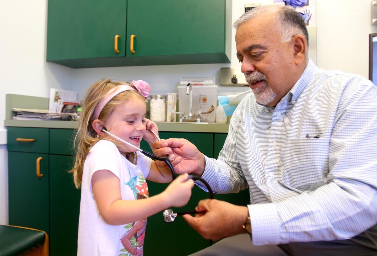 Estelle McKay, 5, asked to listen to the stethoscope after her exam by pediatrician Dr. Rene Bravo (photo from 2019). Bravo was named the San Luis Obispo Chamber of Commerce’s 2020/2021 Citizen of the Year.