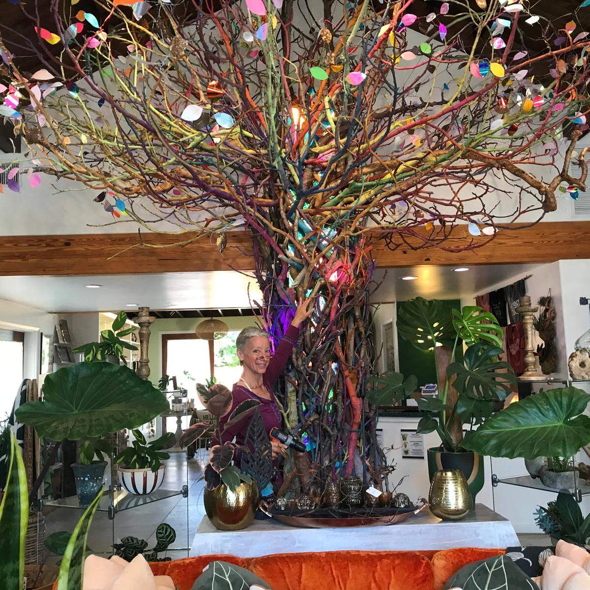 Sally Davis, an artisan and Cambria native, completes her sprawling “Native Tree” art installation on Sept. 1, 2022, at the new Cambria Nursery Downtown store, 4039 Burton Drive in Cambria,