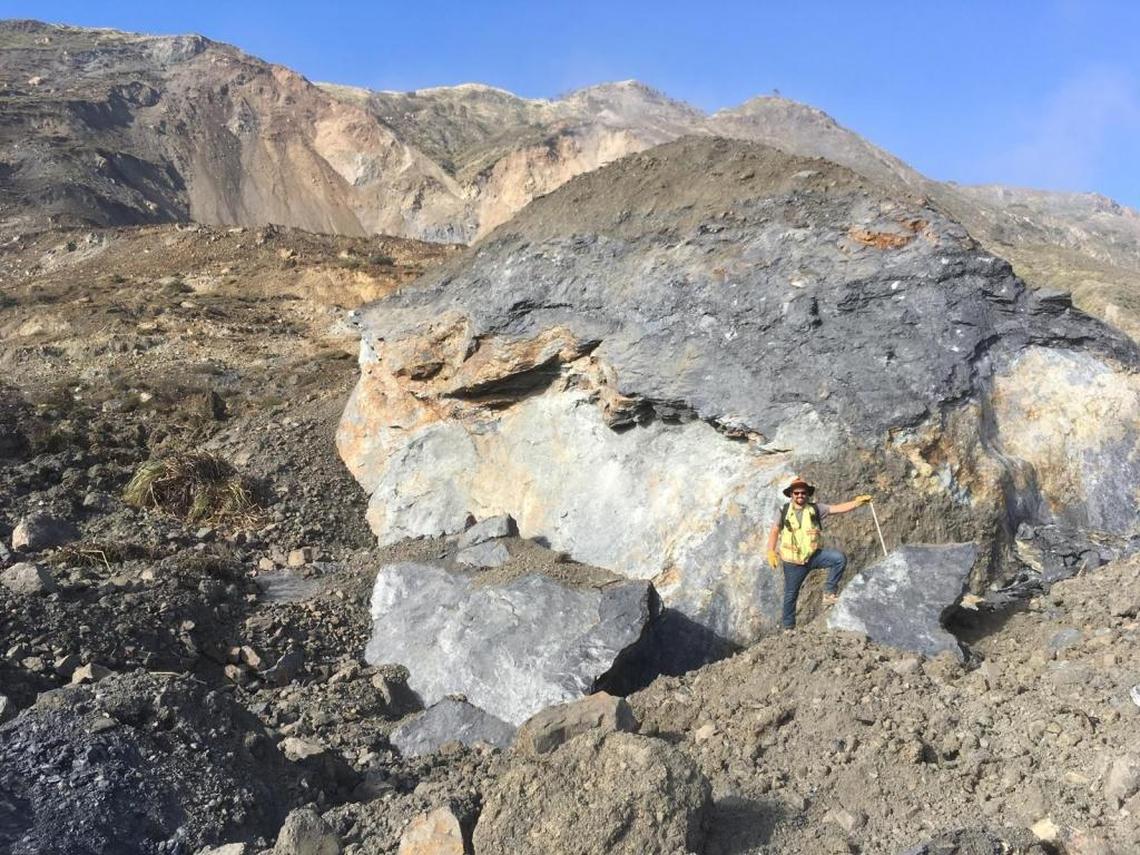 Simon Boone, an engineer for Yeh Engineering, stands by “Pyramid Rock,” where a new radar system will be installed to track landslides.