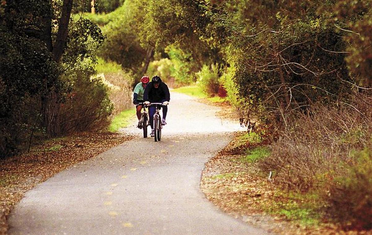 Bicyclists ride along part of the Bob Jones Trail in Avila Beach.