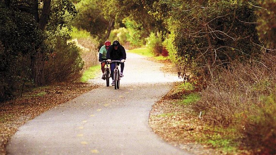Bicyclists ride along part of the Bob Jones Trail in Avila Beach.