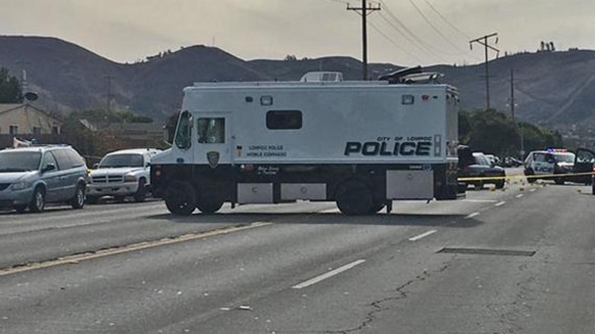 A roadway is blocked off in Lompoc Sunday near the scene of an officer-involved shooting. Police said a homicide suspect was shot after he fired at officers.