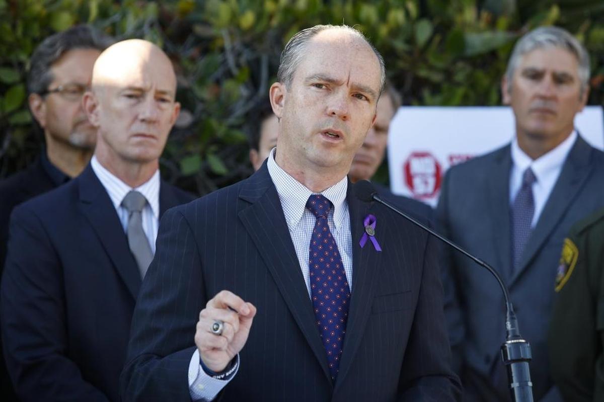 San Luis Obispo District Attorney Dan Dow speaks at a news conference outside the Sheriff’s Office in 2016 to announce local law enforcement’s opposition to the voter initiative Prop. 57.